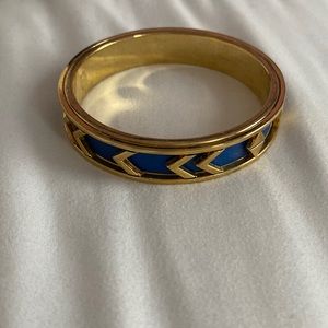 Gold bangle with blue leather